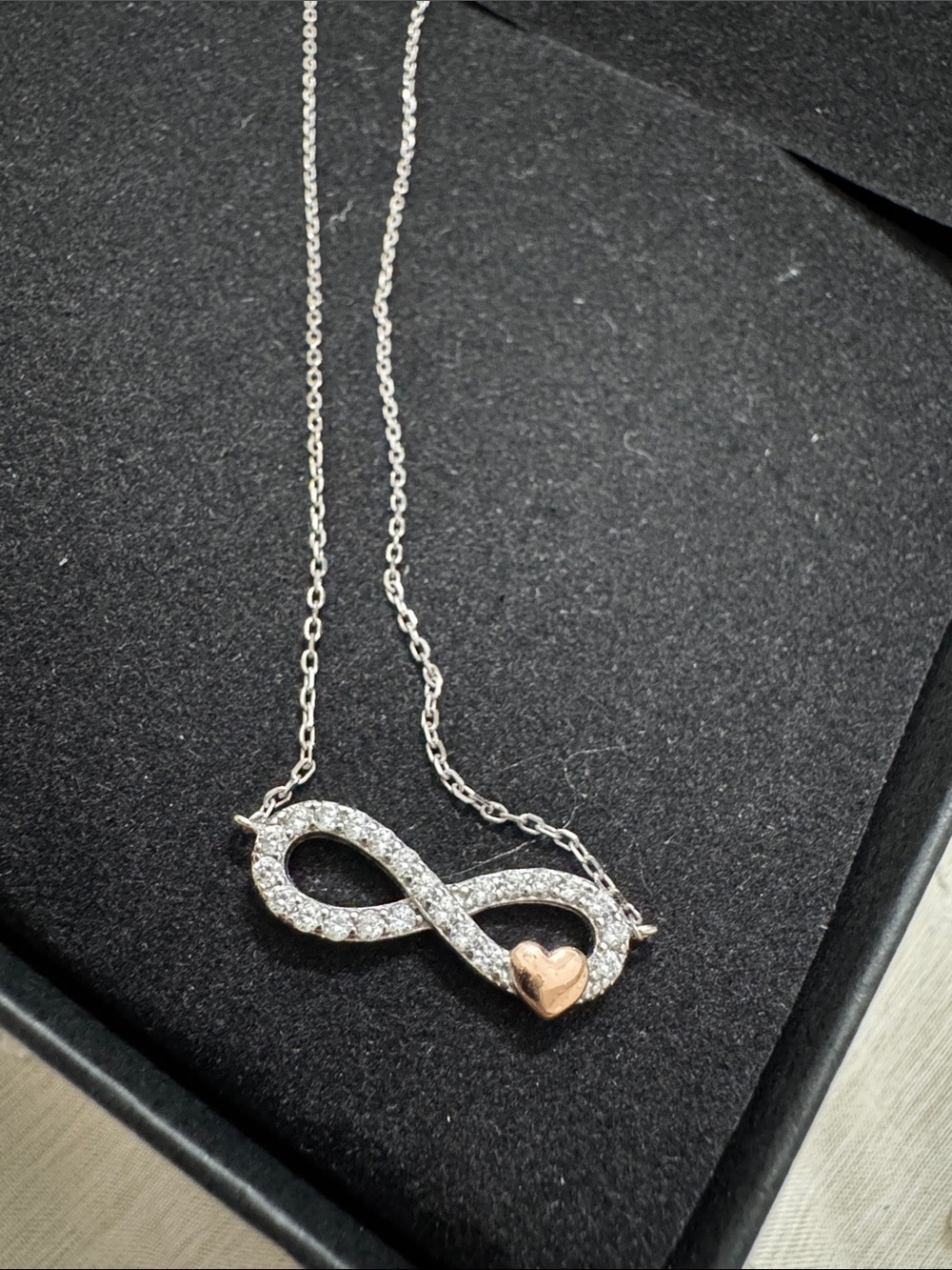 Trendy boutique Silver Infinity Necklace with Rose Gold Heart Accent